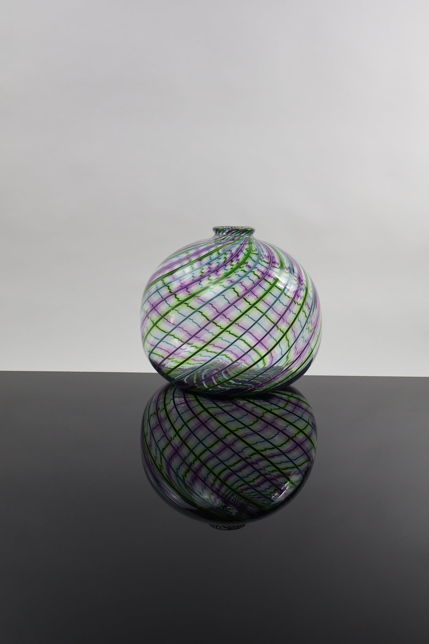 Round Multicolored Veiled Cane Bottle